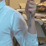 A child holding a scroll during the Passover Seder