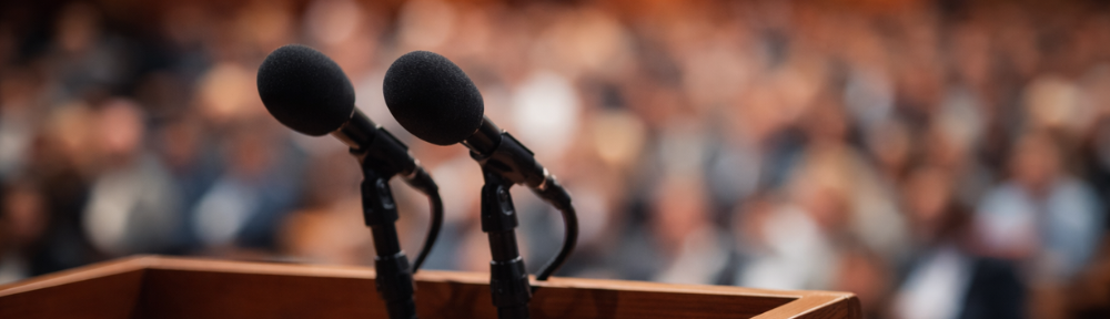 An empty podium with a microphone.